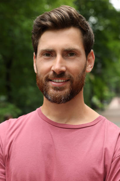 istock Portrait of handsome bearded man in park 1485824612