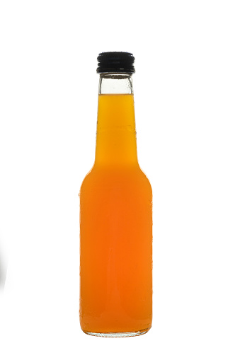 A close up image of a full plastic cola drink bottle with a light grey plastic screw cap, shot against a plain background with a plain white label for graphics to be added.  