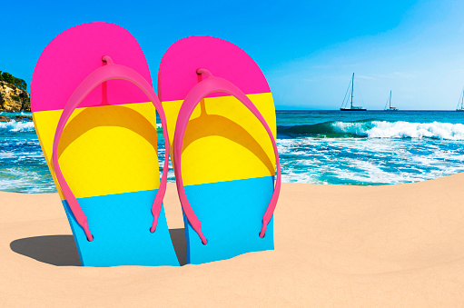 Flip flops with pansexual flag on the beach. 3D rendering