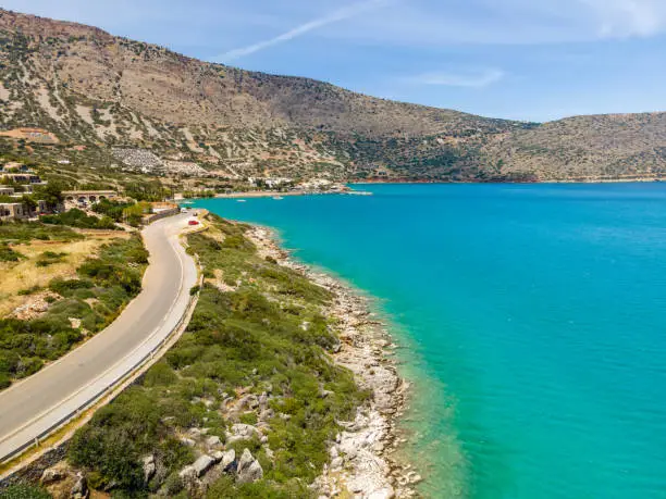 Photo of View of beautiful blue sea with mountains on Crete island. Summer background.