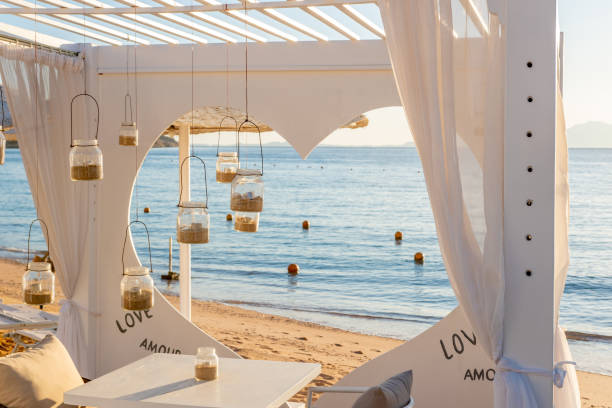 istock Romantic marquee for lunch on a sandy beach. 1485828150