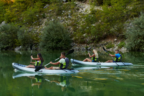 istock A group of friends enjoying having fun and kayaking while exploring the calm river, surrounding forest and large natural river canyons 1485832764