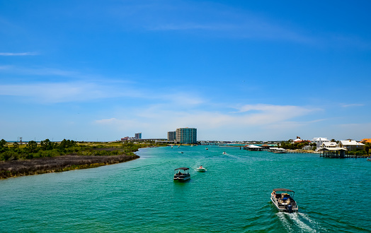 Beautiful turquoise water in Old River, seen from Ono island bridge during late April, Orange Beach, Alabama