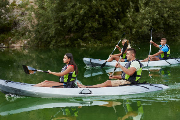istock A group of friends enjoying having fun and kayaking while exploring the calm river, surrounding forest and large natural river canyons 1485834489