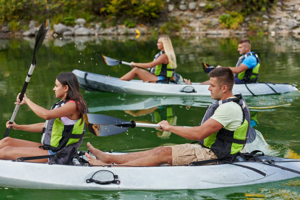 istock A group of friends enjoying having fun and kayaking while exploring the calm river, surrounding forest and large natural river canyons 1485835274