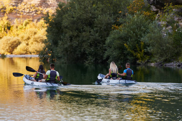 istock A group of friends enjoying having fun and kayaking while exploring the calm river, surrounding forest and large natural river canyons 1485835856