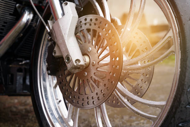 Wheel and disc brake system of a motorcycle close-up.