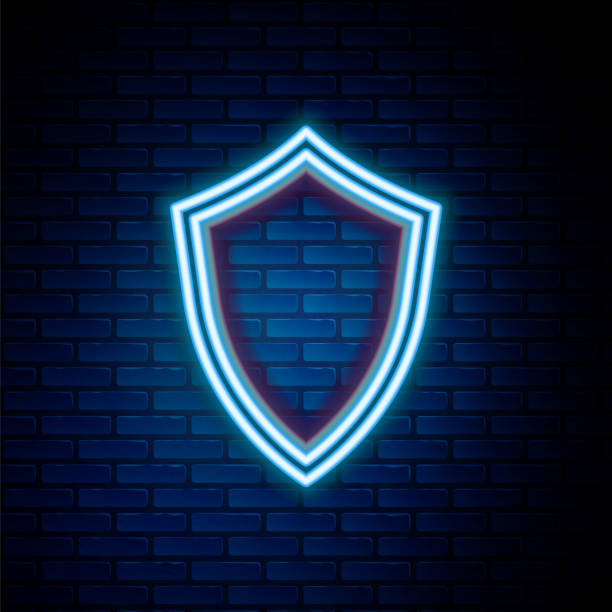 istock Glowing neon line Shield icon isolated on brick wall background. Guard sign. Colorful outline concept. Vector 1485837563