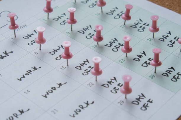 4 day work week printed calendar with pink pins on three days off in week weekend days four day working week concept. Modern approach doing business short workweek. Effectiveness of employees. Productivity and efficiency days off