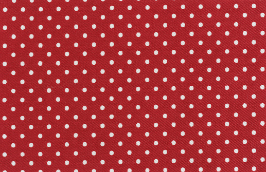 Red and white polka dots baby textile background, Studio shot of high quality fabric sample. Taken with a 42 megapixel full format camera and prime lens