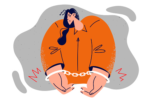 Woman in orange prisoner jumpsuit with hands shackled by handcuffs is sad about upcoming prison sentence or court hearing. Girl prisoner needs support of lawyer to get fair decision judge after crime