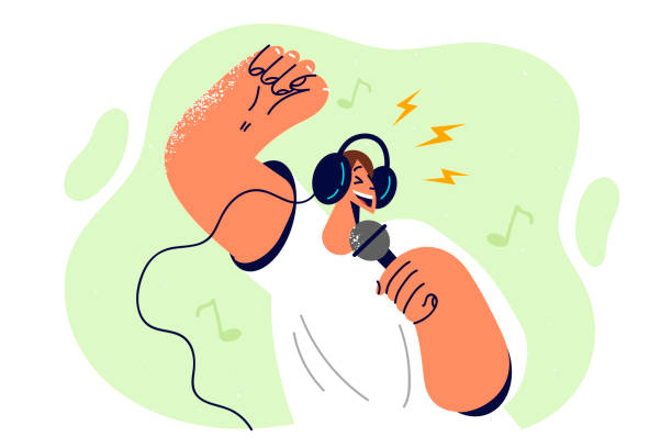 istock Positive man in headphones holding microphone enjoying singing in karaoke club while relaxing 1485841967