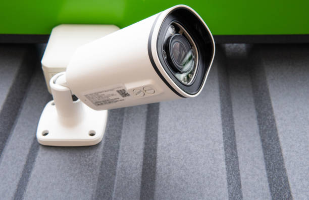 istock CCTV surveillance camera in factory area to control security system area with torch light and copy space 1485842631