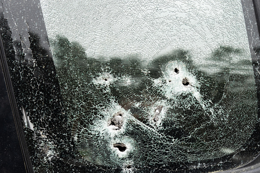 Abstract image of broken glass texture, background. Close-up of a broken car windshield. Broken and damaged car