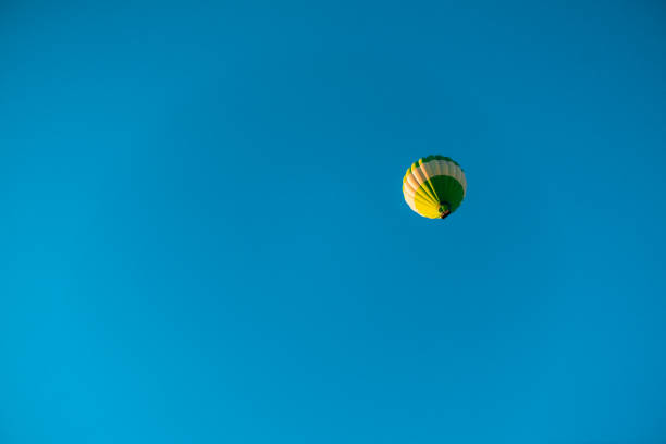 Free Stock Photo of Large Hot Air Balloon Flying Through Blue Sky ...