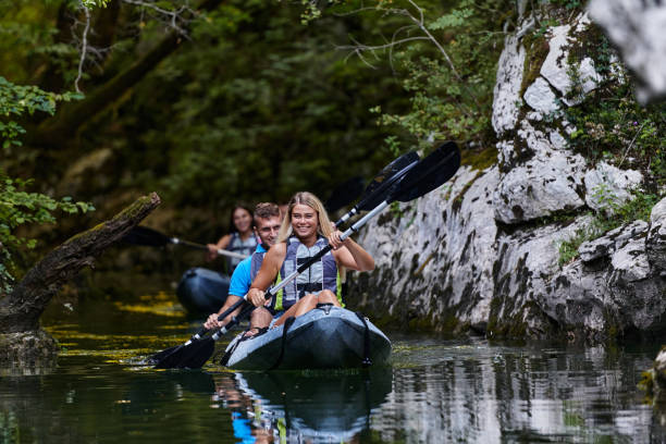 istock A group of friends enjoying having fun and kayaking while exploring the calm river, surrounding forest and large natural river canyons 1485846485