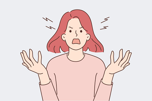 Furious woman screaming due to uncontrollable aggression and panic attack caused by psychological illness. Girl screaming loudly and waving hands during quarrel based on gender discrimination