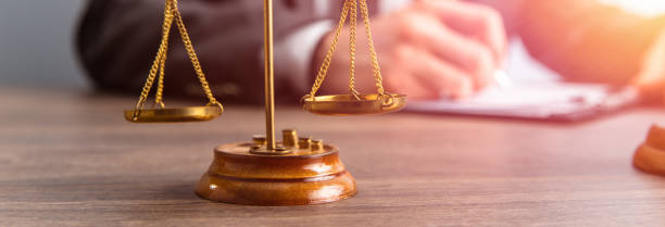 istock scales and lawyer working on papers 1485851014