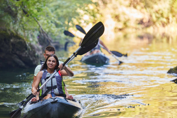istock A group of friends enjoying having fun and kayaking while exploring the calm river, surrounding forest and large natural river canyons 1485853035