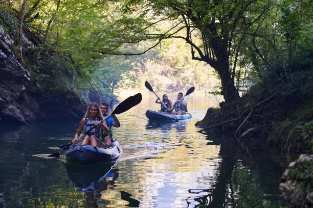istock A group of friends enjoying having fun and kayaking while exploring the calm river, surrounding forest and large natural river canyons 1485854727