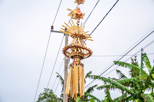 Penjor at the celebration of the Galungan holiday of Balinese Hindus. Penjor is a symbol of Naga Basuki which means welfare and prosperity