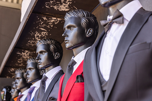 Europe, Netherlands, North Holland, Beverwijk. Mannequins in dress suits and ties.