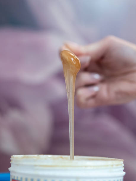 istock Melted depilatory wax dripping with blurred background 1485858616