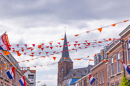 Europe, Netherlands, Utrecht, Maarssen. Flags and banners put up for the King's Day celebrations in Maarssen.