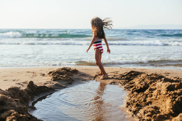 istock Girl playing in the pond 1485865074