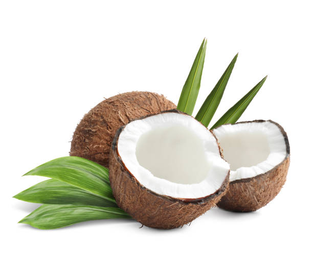 istock Tasty ripe coconuts and green leaves on white background 1485868002