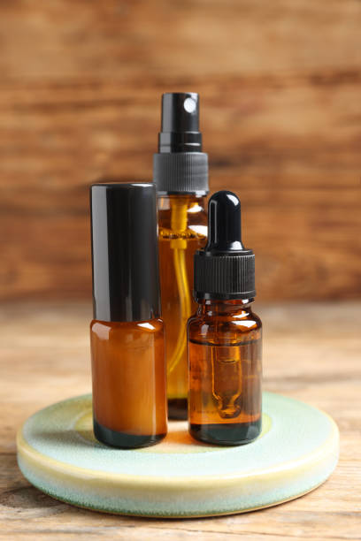 istock Bottles with oil on wooden table. Natural cosmetics 1485868657