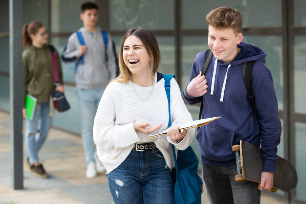 istock Cheerful teenagers talking outside after lessons 1485868752
