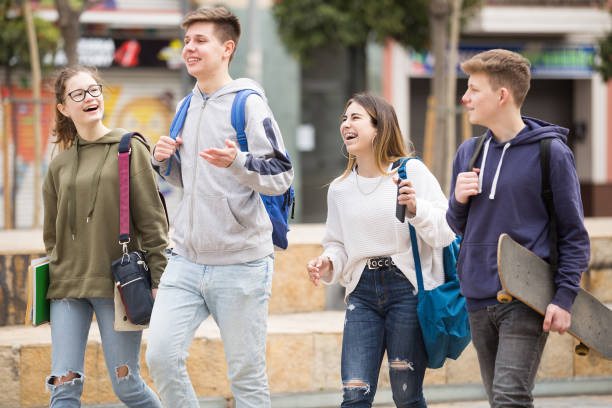 istock Smiling teenagers walking outside after lessons 1485869566
