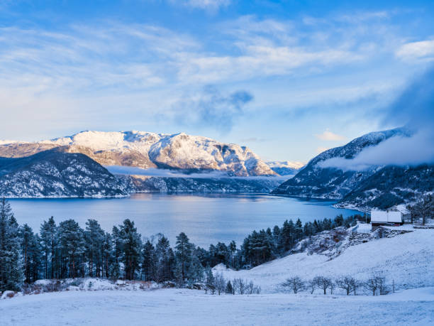 istock Hardangerfjord and log cabins at sunset during early winter in Kinsarvik, Norway 1485869921