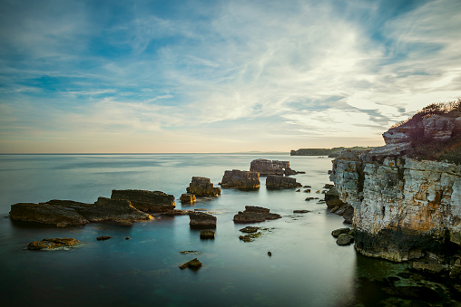 sunrise on the turkish black sea coast. Cliffs and reefs bathed in the light of the rising sun