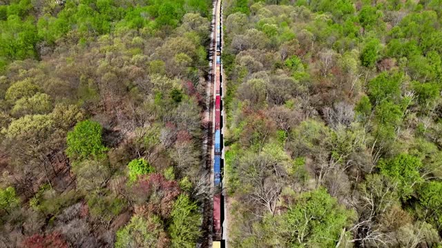 CSX train heading from Barnesville station towards Dickerson station in Maryland - Aerial Flyover