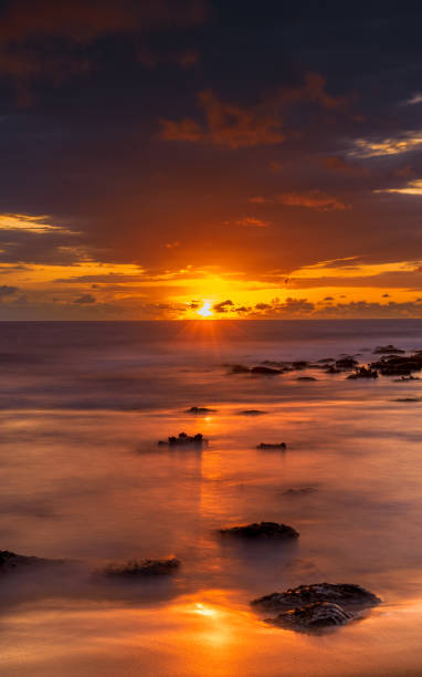 istock Sunrise with scattered rain clouds at the seaside 1485882390