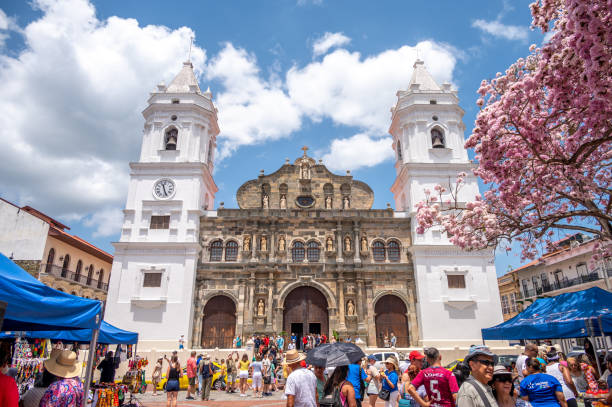 Panama City, Panama - June 12, 2025: Incidental people and the colonial facade of the Cathedral building, historic district
