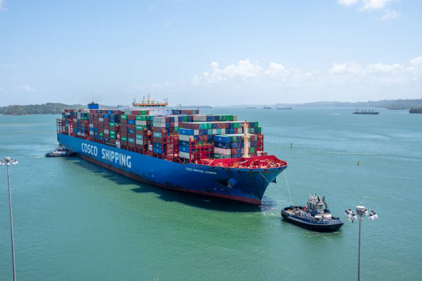 Panama Canal Views Colon, Panama - April 2, 2023: Views of a container ship at the Agua Clara Locks on the Panama canal. panama canal expansion stock pictures, royalty-free photos & images