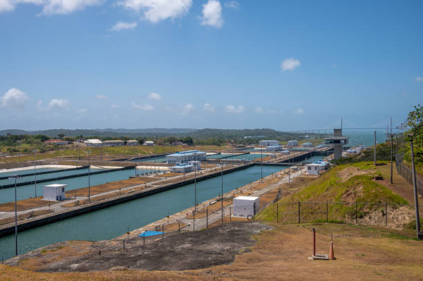 Panama Canal Views Colon, Panama - April 2, 2023: Views of a container ship at the Agua Clara Locks on the Panama canal. panama canal expansion stock pictures, royalty-free photos & images