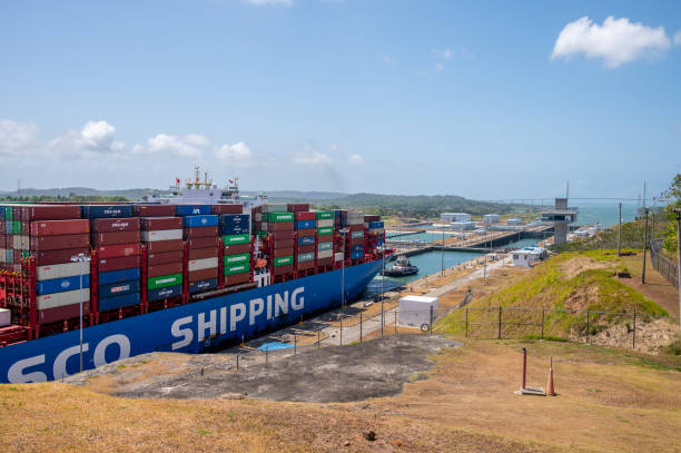 Panama Canal Views Colon, Panama - April 2, 2023: Views of a container ship at the Agua Clara Locks on the Panama canal. panama canal expansion stock pictures, royalty-free photos & images