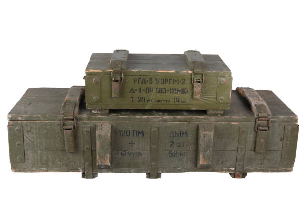 istock Stack of army ammunition green crates. Text in russian - type of ammunition, projectile caliber, projectile type, number of pieces and weight. 1485889324