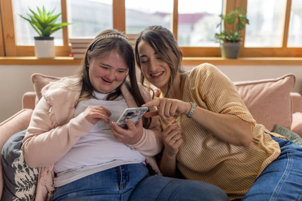 istock Female friends using phone together 1485891049