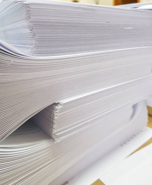istock A stack of blank paper, book blocks prepared for binding in a printing house 1485894204