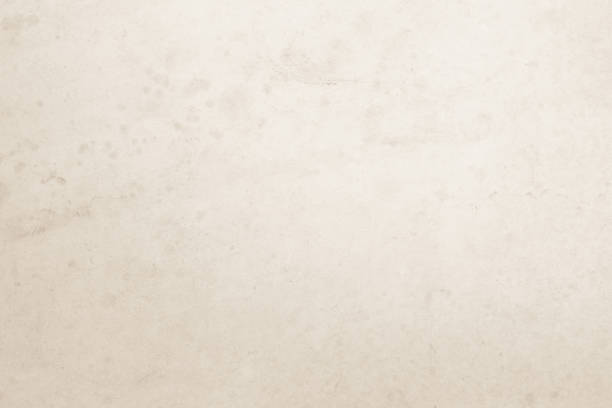 istock Colour old concrete wall texture background. Close Up retro plain cream color cement wall background texture. Design paper vintage parchment element show or advertise or promote product on display. 1485894349