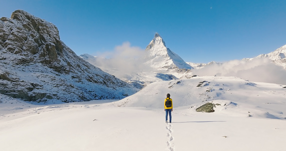 Drone Point Of View, Happiness of traveler women standing to visit famous landmarks Matterhorn in Switzerland.
