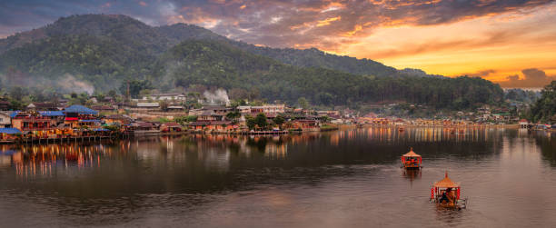 istock Chinese boats and a cloudy sunset at Ban Rak Thai 1485896218