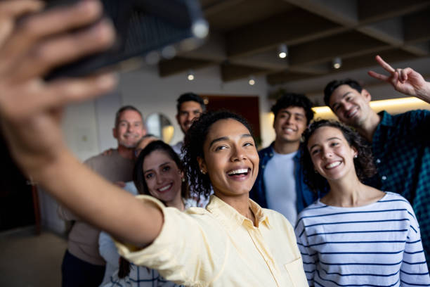 istock Happy group of workers taking a selfie at the office 1485907909