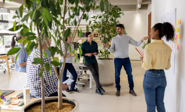 Businessman making a presentation to his team at the office