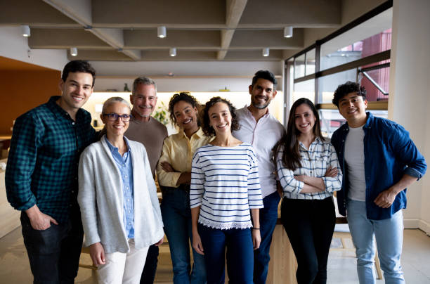istock Happy business team smiling at the office 1485907968